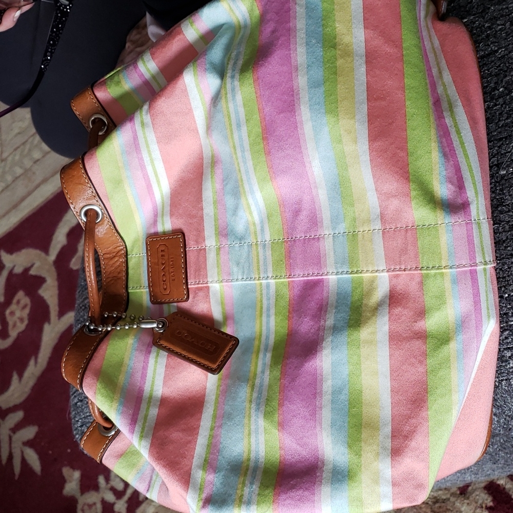 Coach backpack with drawstring opening. Spring/Summer stripes. Worn a few times.
